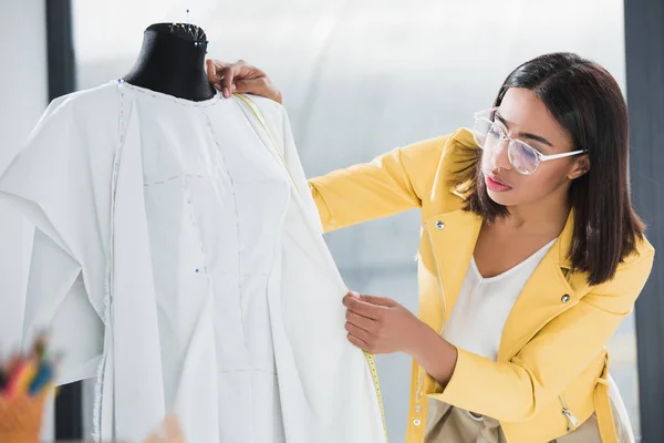 Dressmaker working with dummy — Stock Photo