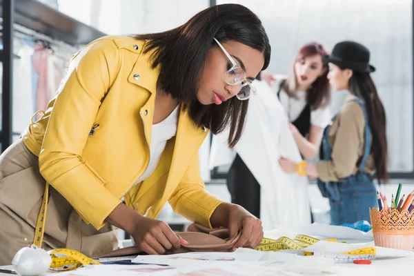 Fashion designer in workshop — Stock Photo