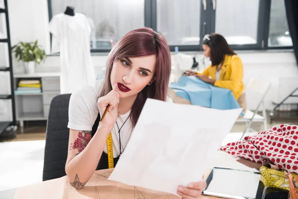 Fashion designer working on sketch — Stock Photo