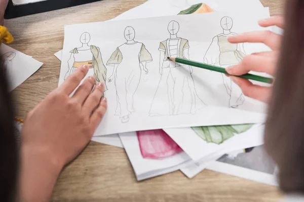 Fashion designers working with blueprints — Stock Photo