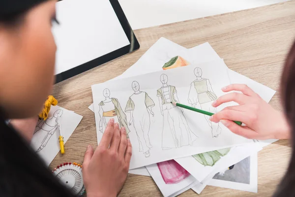 Fashion designers working with blueprints — Stock Photo