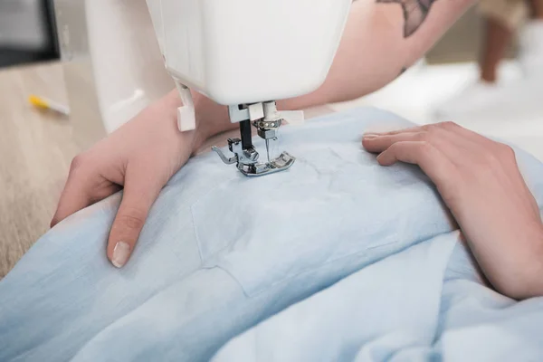 Seamstress using sewing machine — Stock Photo