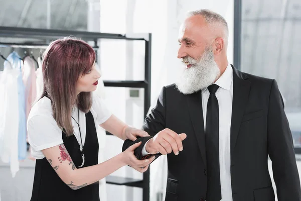 Senior man with tailor fitting suit — Stock Photo