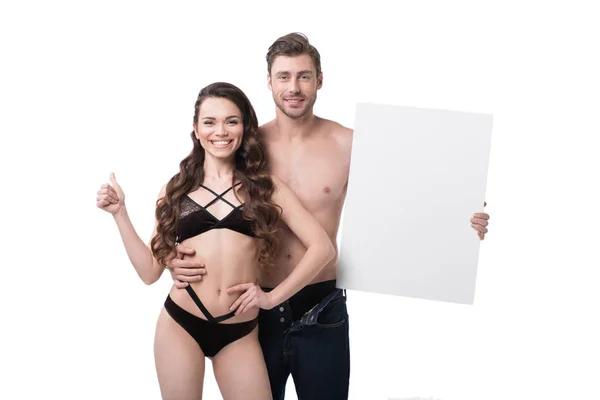 Pareja con banner en blanco - foto de stock