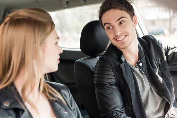 Young couple riding car — Stock Photo