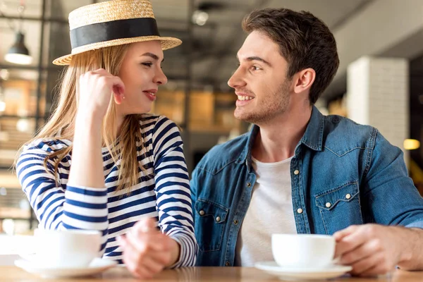 Couple drinking coffee in cafe — Stock Photo