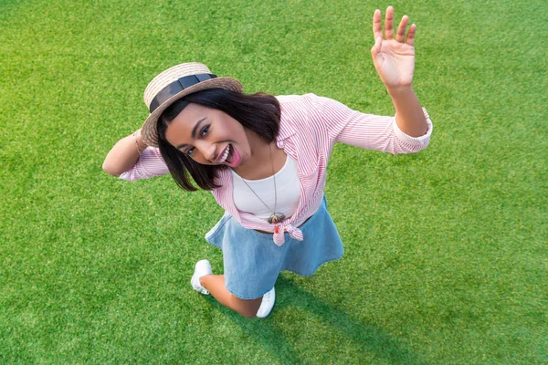 African american girl resting on grass — Stock Photo