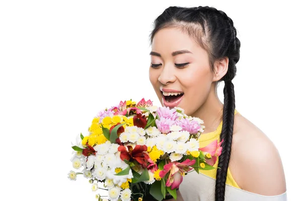 Asian woman with bouquet of flowers — Stock Photo