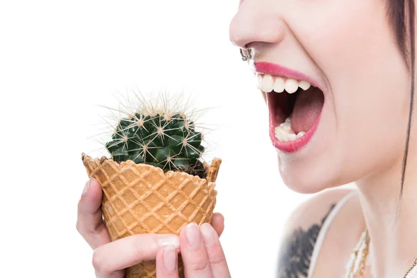Woman eating cactus — Stock Photo