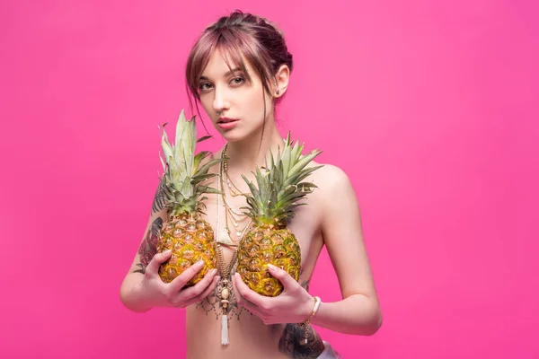 Naked woman with pineapples — Stock Photo