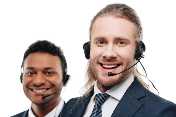 Multiethnic operators with headsets — Stock Photo