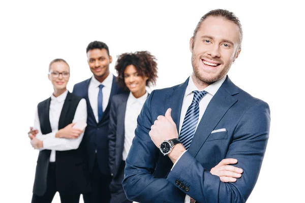 Handsome businessman with colleagues — Stock Photo