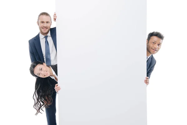 Businesspeople with empty board — Stock Photo