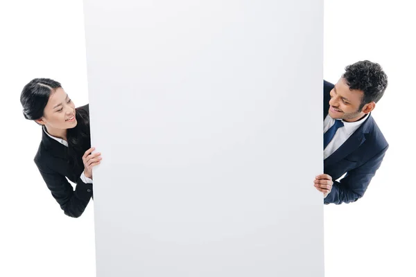 Businesspeople with empty board — Stock Photo