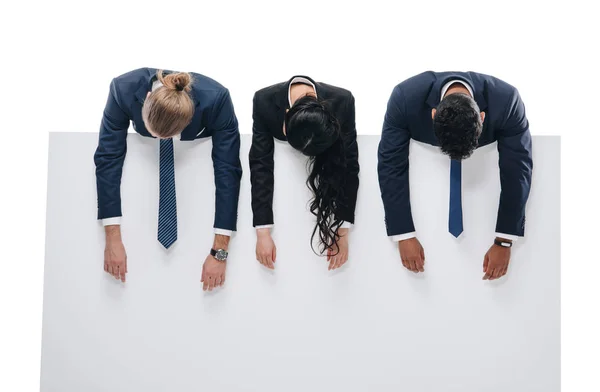 Exhausted businesspeople with empty board — Stock Photo