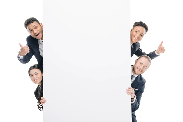 Multiethnic businesspeople with empty board — Stock Photo