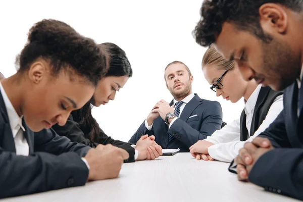 Businessman looking at guilty colleagues — Stock Photo