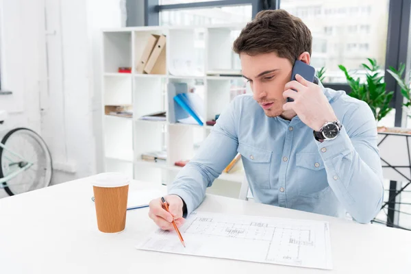 Architect working with blueprint — Stock Photo