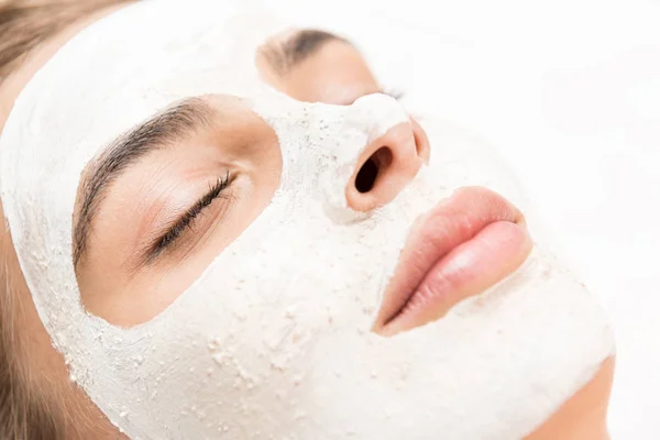 Woman with facial mask — Stock Photo