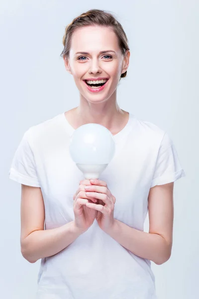Woman with light bulb — Stock Photo