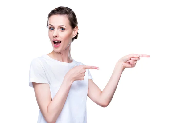 Surprised pointing woman — Stock Photo