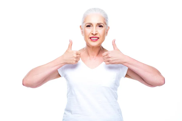 Senior woman with thumbs up — Stock Photo