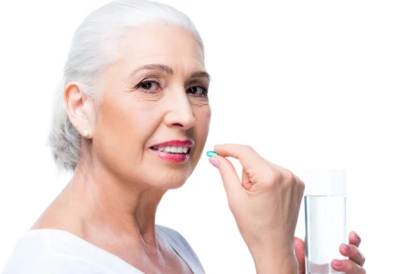 Senior woman with pill — Stock Photo