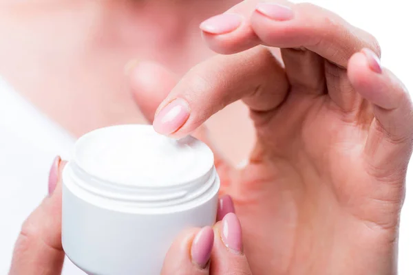 Senior woman with face cream — Stock Photo