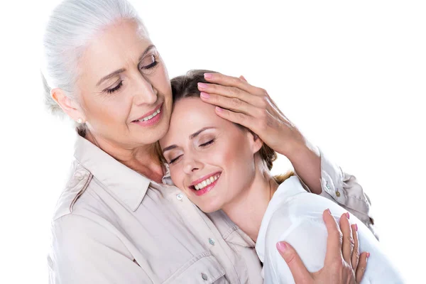 Senior mother hugging adult daughter — Stock Photo