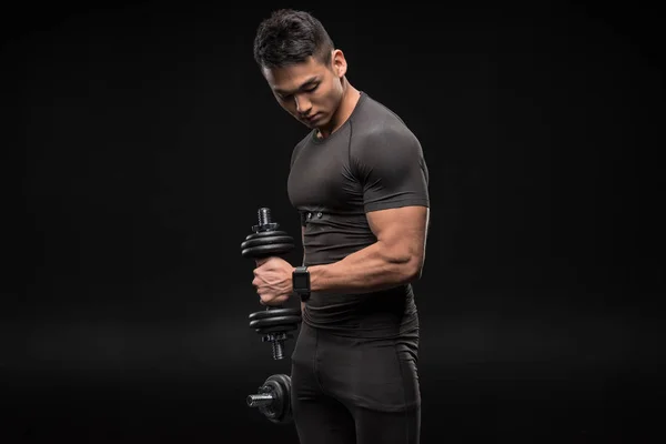 Muscular man with dumbbells — Stock Photo