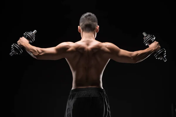 Muscular man with dumbbells — Stock Photo