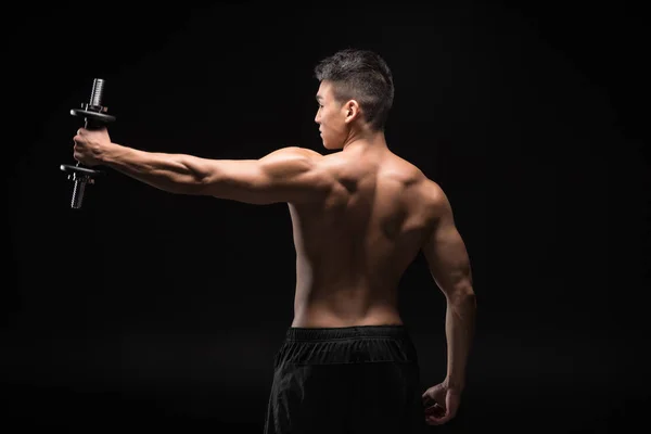 Muscular man with dumbbell — Stock Photo