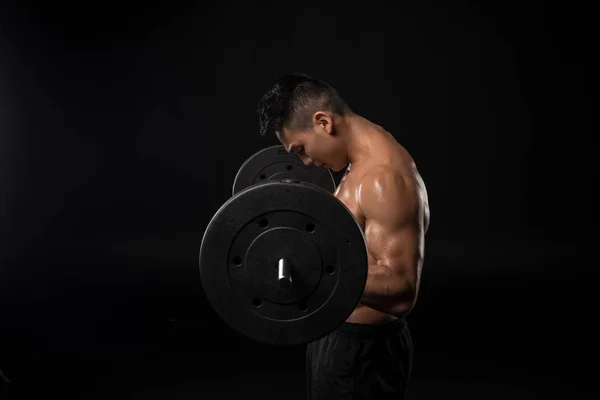 Muscular asian man with barbell — Stock Photo