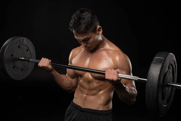 Muscular asian man with barbell — Stock Photo