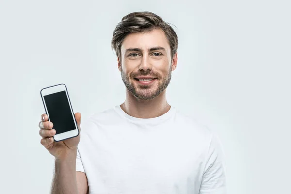 Hombre mostrando Smartphone - foto de stock