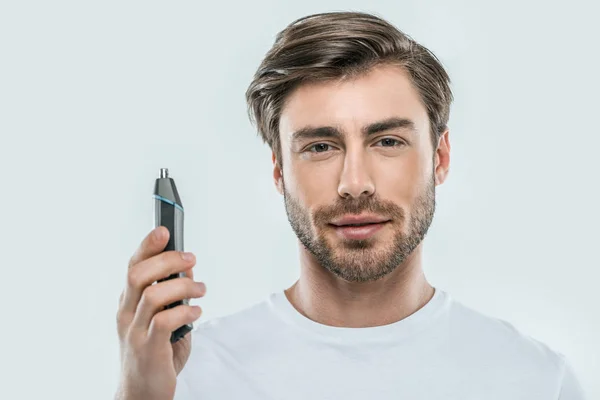 Hombre con trimmer eléctrico - foto de stock