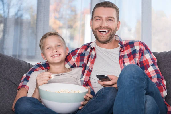 Father and son watching tv — Stock Photo