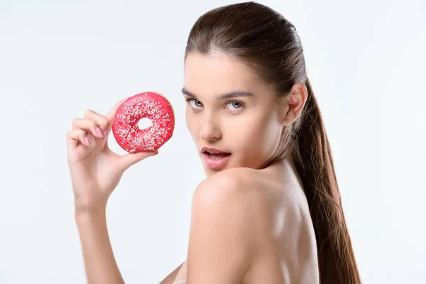 Woman holding donut — Stock Photo