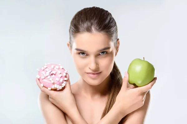 Donut and green apple — Stock Photo