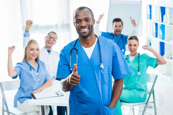 Doctor showing thumb up — Stock Photo