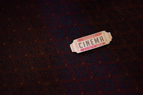 One cinema ticket in movie theater — Stock Photo