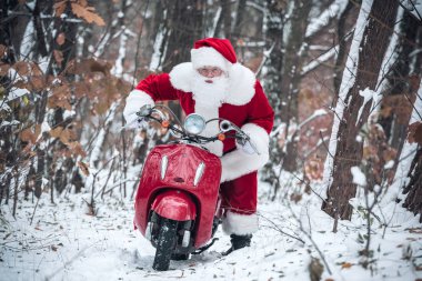 Santa Claus riding red scooter clipart