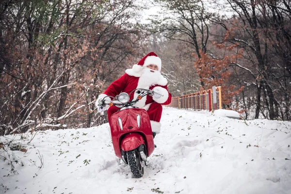 Santa Claus riding on scooter — Stock Photo, Image