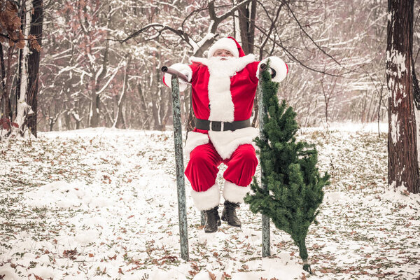 Santa Claus doing push ups in forest