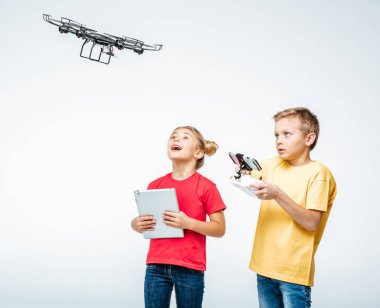 Kids using digital tablet and hexacopter drone clipart