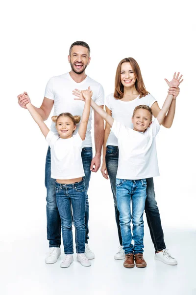 Família feliz com as mãos levantadas — Fotografia de Stock