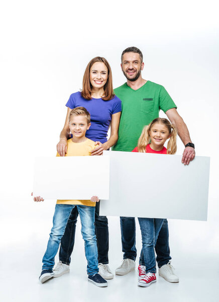 family standing with blank white cards