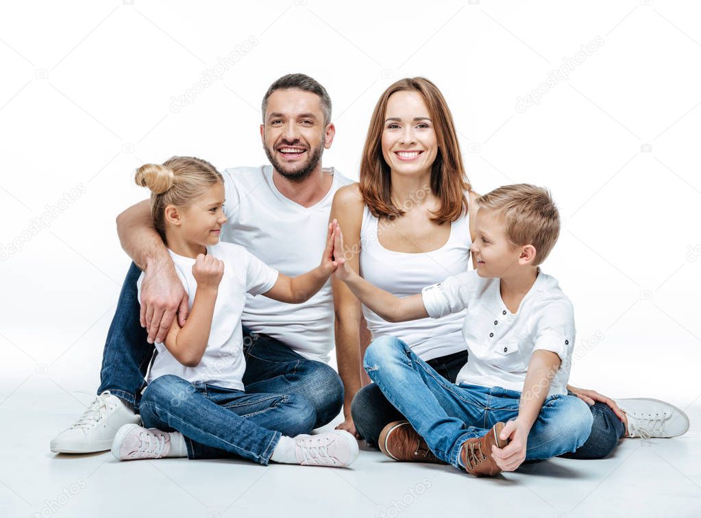 Happy family sitting together