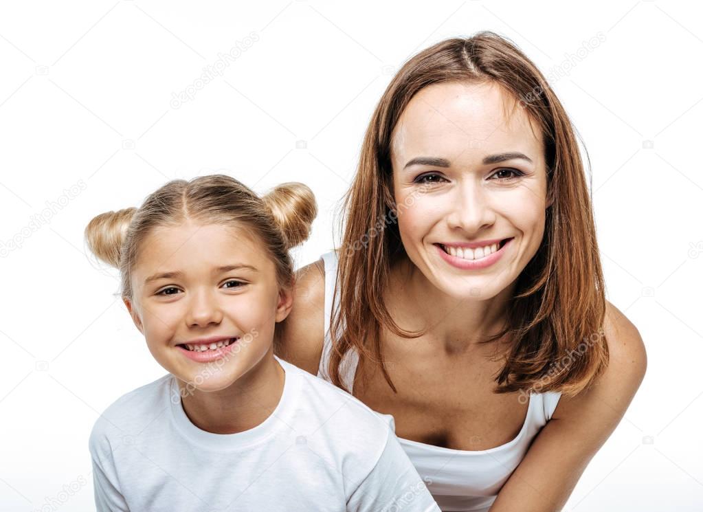 Smiling mother and daughter