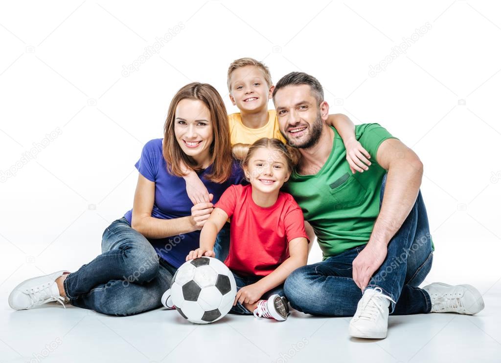 Happy family with soccer ball